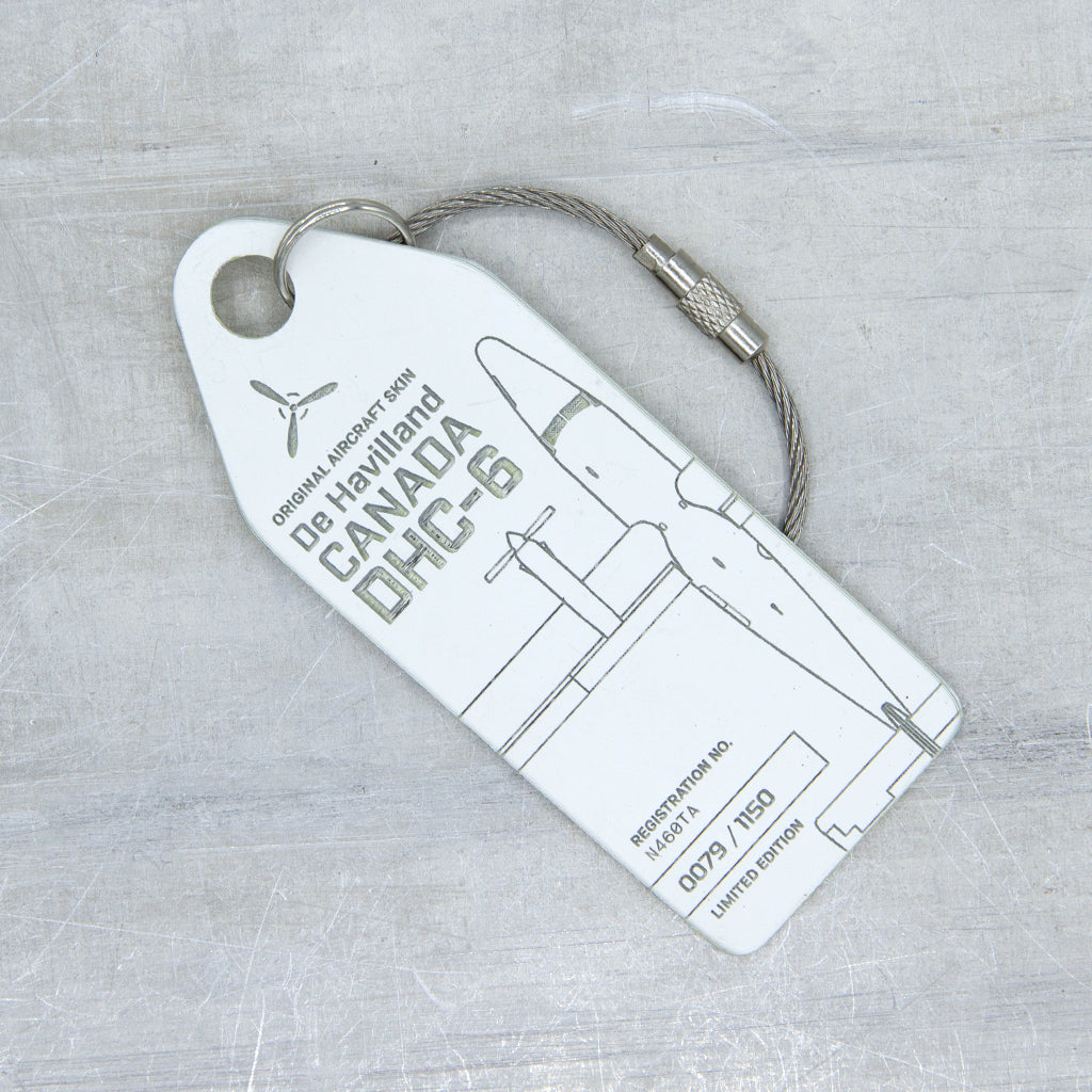 Front view of white Aviationtag DHC-6 Twin Otter tag, made from original fuselage panel of historic aircraft, limited edition aircraft tag
