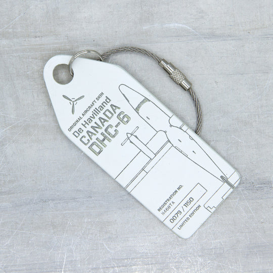 Front view of white Aviationtag DHC-6 Twin Otter tag, made from original fuselage panel of historic aircraft, limited edition aircraft tag