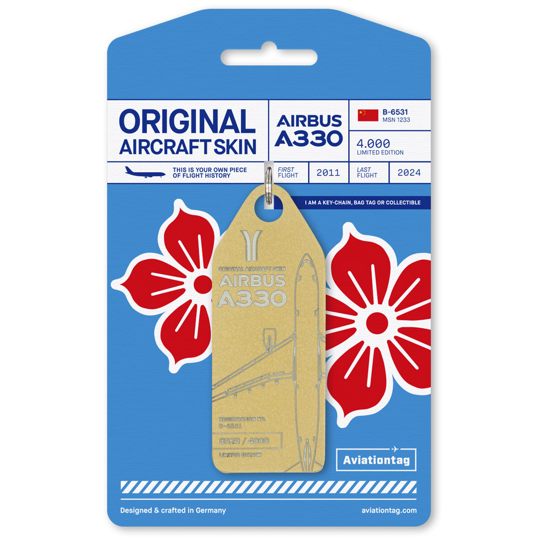 Aviationtag made from China Southern Airbus A330-200 B-6531 fuselage – upcycled aircraft skin, limited edition plane tag, aviation memorabilia. Golden aircraft tag with cardboard packaging.