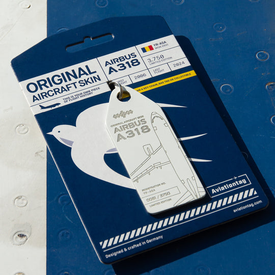 10 Years of Aviationtag - Airbus A318 YR-ASA aircraft tag edition ex Tarom. Image shows the white tag on its blue packaging placed on a blue and white aircraft panel