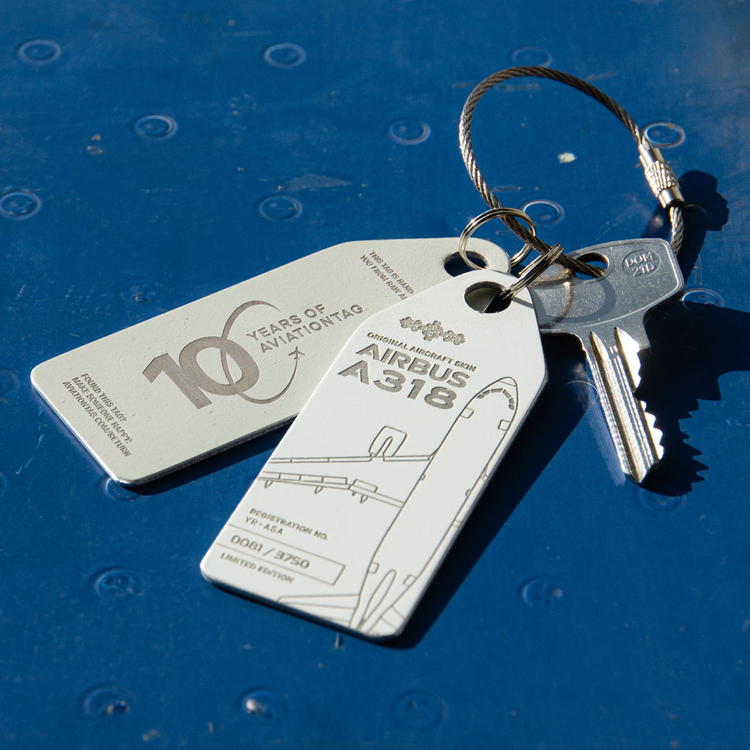 10 Years of Aviationtag - Airbus A318 YR-ASA aircraft tag edition ex Tarom. Image shows the white plane tag and its backside on a key chain