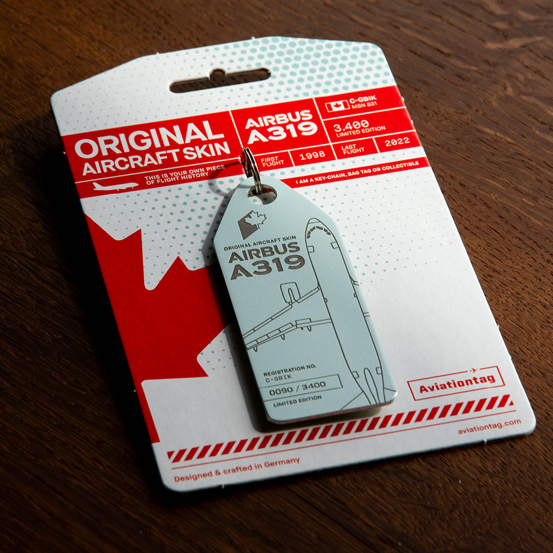 Aviationtag Airbus A319 C-GBIK Edition ex AIr Canada & Jetz aircraft tag on cardboard in a moody light