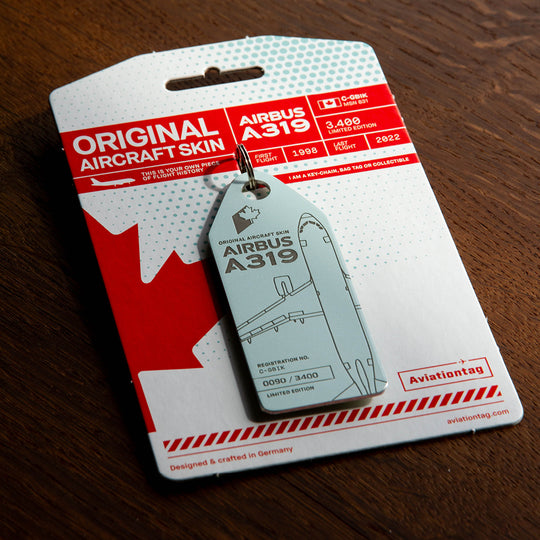 Aviationtag Airbus A319 C-GBIK Edition ex AIr Canada & Jetz aircraft tag on cardboard in a moody light