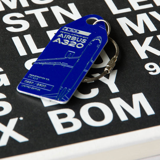 Aviationtag Airbus A320neo Edition VT-WJC GoAir Aircraft Tag Edition - Blue plane tag on airport book