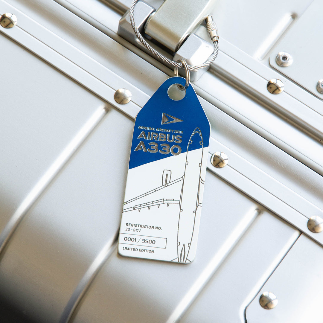 South African Airways Airbus A330 ZS-SKV Aviationtag Edition Blue/White aircraft tag on a silver suitcase