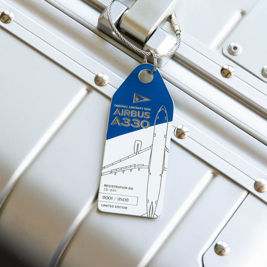 South African Airways Airbus A330 ZS-SKV Aviationtag Edition Blue/White aircraft tag on a silver suitcase