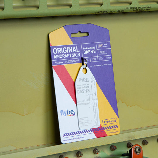 Aviationtag Flybe Tribute Edition Dash 8 G-PRPG aircraft tag white with  cardboard packaging on aircraft panel