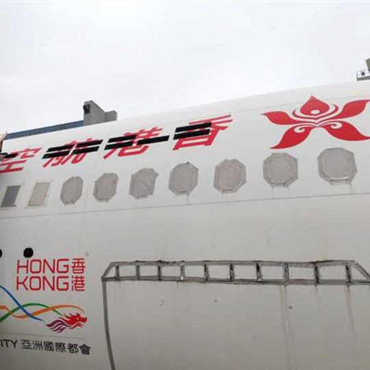 Dismantling scene of Hong Kong Airlines A330-223 B-LNF; fuselage sections removed for Aviationtag production—authentic aircraft skin upcycling.