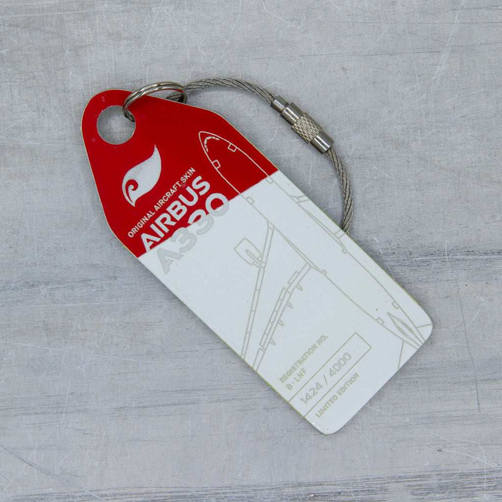 Close-up of aircraft tag cut from upcycled fuselage panel—Aviationtag from Airbus A330 B-LNF; authentic patina and precise engraving visible.