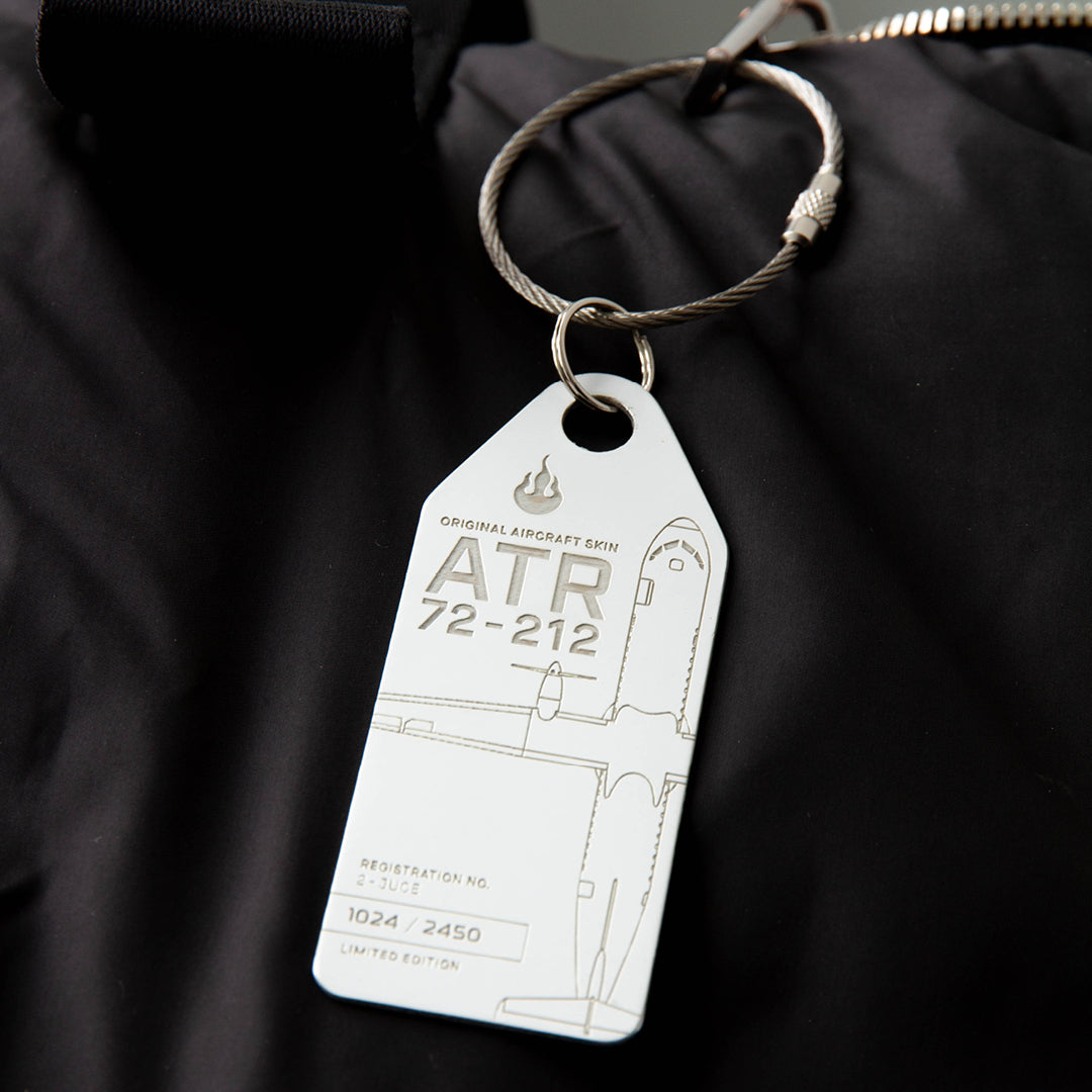 Aviationtag Edition Hunnu Air ATR 72-212 2-JUCE Aircraft Tag White on a black bag as a baggage tag