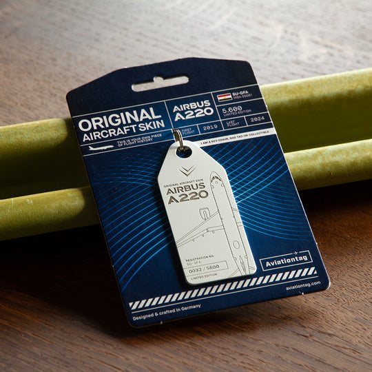 Aviationtag Airbus A220 SU-GFA Edition ex-Egypt Air - White aircraft tag on packaging in a mood photo on aircraft stringer