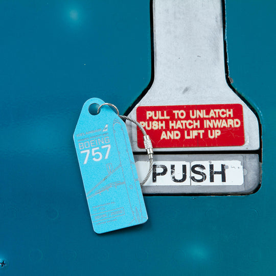 Aviationtag x Icelandair Hekla Aurora Boeing 757 TF-FIU Edition - light blue variant aircraft tag on plane exit door
